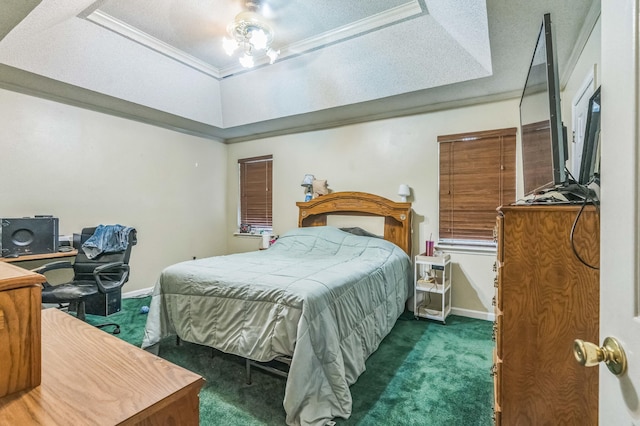 bedroom featuring carpet, a tray ceiling, baseboards, and ornamental molding