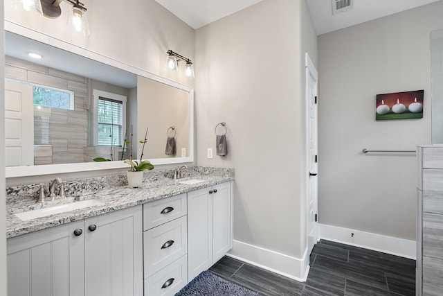 134 Twelve Oaks Dr, Mccormick, SC 29835 - bathroom with a sink, visible vents, baseboards, and double vanity