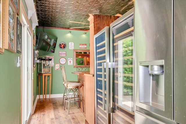 209 Apple Ln, Mccormick, SC 29835 - doorway with an ornate ceiling, a dry bar, wood finished floors, and baseboards
