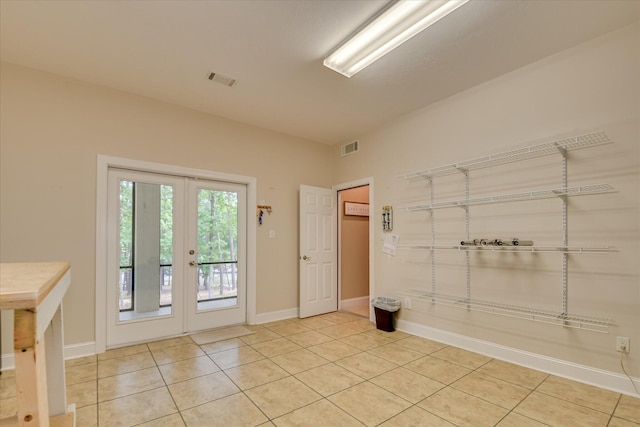 209 Apple Ln, Mccormick, SC 29835 - spare room featuring french doors, light tile patterned floors, and baseboards