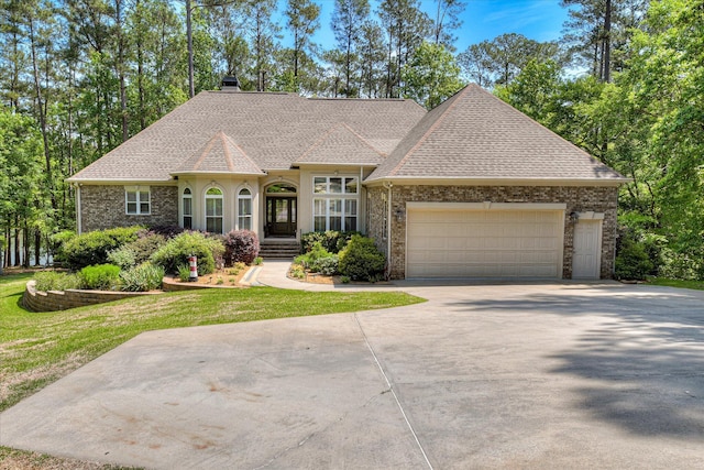 209 Apple Ln, Mccormick, SC 29835 - french country inspired facade featuring a shingled roof, driveway, a chimney, an attached garage, and a front yard