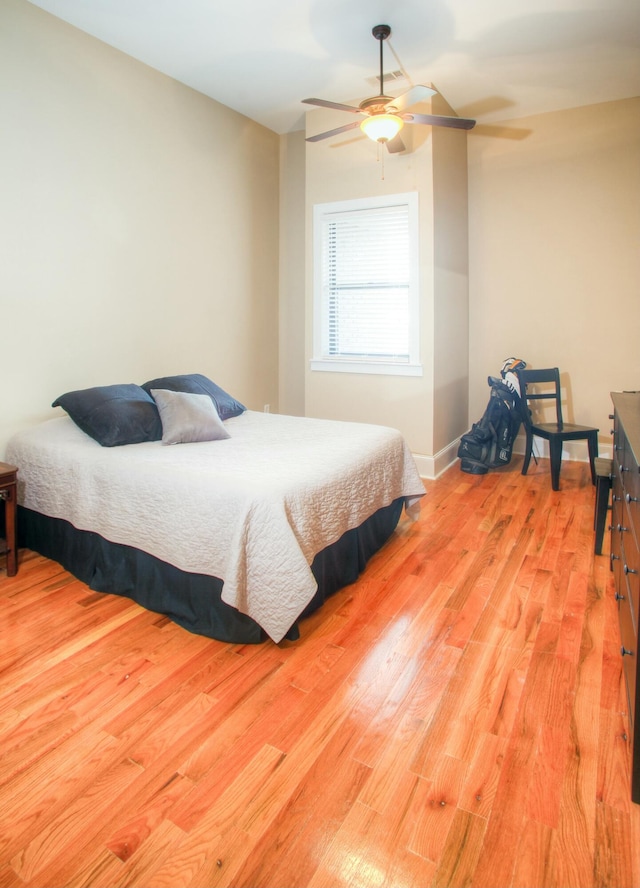 bedroom featuring light hardwood / wood-style floors and ceiling fan