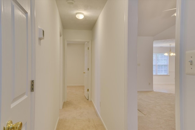 1008 Storey Mill Ct, Hephzibah, GA 30815 - hallway featuring light carpet and a chandelier