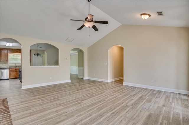 2030 Lake Forest Dr, Grovetown, GA 30813 - unfurnished living room with a ceiling fan, light wood finished floors, vaulted ceiling, and arched walkways