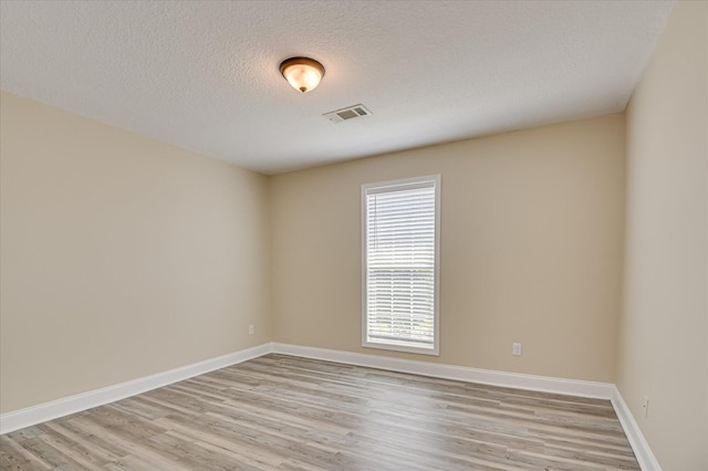 2030 Lake Forest Dr, Grovetown, GA 30813 - unfurnished room with light wood-type flooring and a textured ceiling