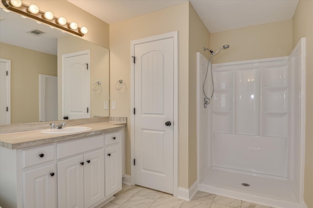 2030 Lake Forest Dr, Grovetown, GA 30813 - full bathroom with marble look tiles, vanity, and a shower