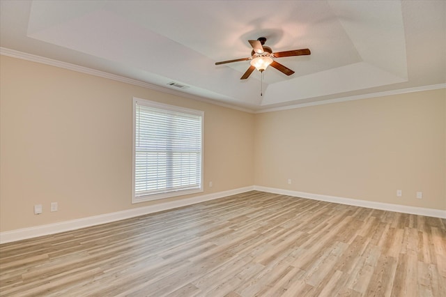 2030 Lake Forest Dr, Grovetown, GA 30813 - spare room featuring a tray ceiling, ceiling fan, light wood-style flooring, and ornamental molding