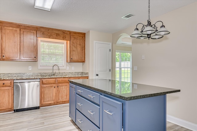 2030 Lake Forest Dr, Grovetown, GA 30813 - kitchen with stainless steel dishwasher, a chandelier, light wood finished floors, arched walkways, and hanging light fixtures