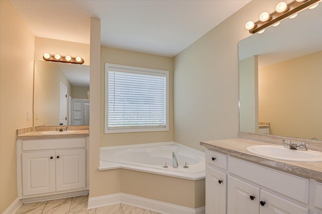 2030 Lake Forest Dr, Grovetown, GA 30813 - full bathroom with two vanities, a bath, and marble look tiles