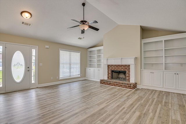 2030 Lake Forest Dr, Grovetown, GA 30813 - unfurnished living room with lofted ceiling, ceiling fan, light wood-type flooring, and a fireplace