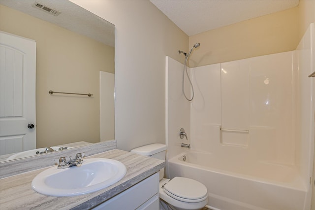 2030 Lake Forest Dr, Grovetown, GA 30813 - bathroom with vanity, bathing tub / shower combination, and a textured ceiling