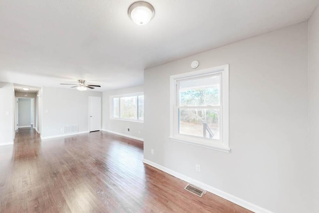 spare room featuring ceiling fan and wood-type flooring