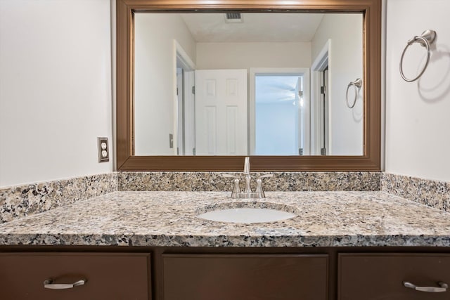 bathroom with vanity and visible vents