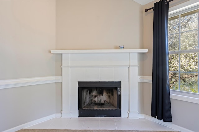 room details featuring a tile fireplace