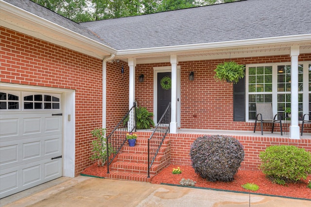 138 Evergreen Ln, Mccormick, SC 29835 - property entrance featuring brick siding, a shingled roof, a garage, and driveway