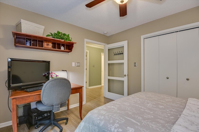138 Evergreen Ln, Mccormick, SC 29835 - bedroom featuring wood finished floors, a closet, baseboards, a desk, and a ceiling fan