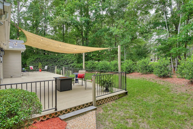 138 Evergreen Ln, Mccormick, SC 29835 - view of grassy yard with a deck, a fire pit, and view of scattered trees