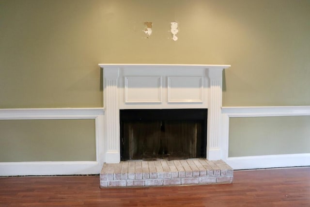 room details with wood finished floors and a fireplace