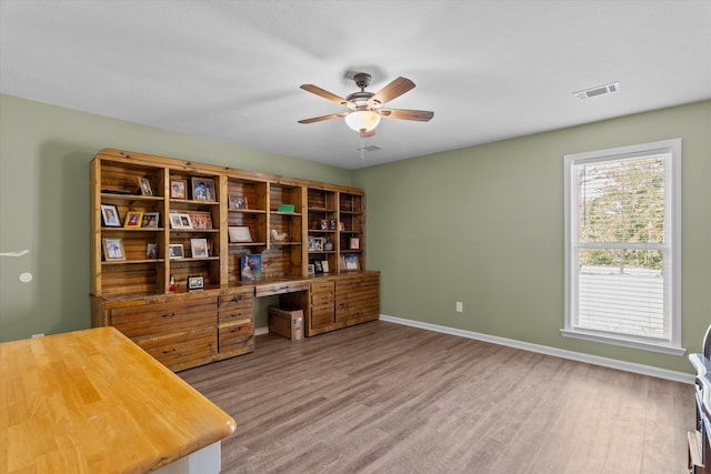 3604 Hillman Gay Rd, Dearing, GA 30808 - home office featuring a ceiling fan, wood finished floors, and baseboards