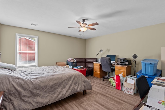 3604 Hillman Gay Rd, Dearing, GA 30808 - bedroom with light wood-style flooring, a desk, and ceiling fan