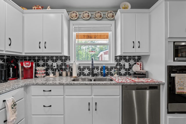 3604 Hillman Gay Rd, Dearing, GA 30808 - kitchen featuring stainless steel appliances, a sink, white cabinetry, and tasteful backsplash