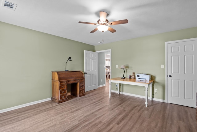 3604 Hillman Gay Rd, Dearing, GA 30808 - home office featuring a ceiling fan, wood finished floors, and baseboards