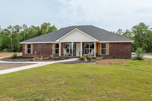 3604 Hillman Gay Rd, Dearing, GA 30808 - single story home featuring a porch, brick siding, a front lawn, and roof with shingles