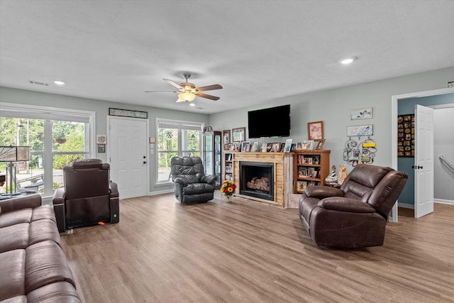 3604 Hillman Gay Rd, Dearing, GA 30808 - living room with light wood-style floors, ceiling fan, a fireplace, recessed lighting, and baseboards