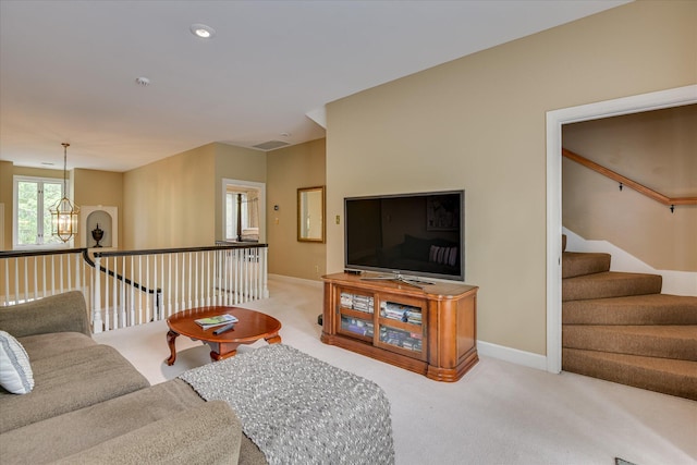 8 Tall Pine Ct, Augusta, GA 30909 - living area with light colored carpet, a chandelier, and baseboards