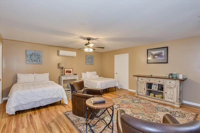 8 Tall Pine Ct, Augusta, GA 30909 - bedroom featuring a wall mounted air conditioner, light wood finished floors, baseboards, and a ceiling fan