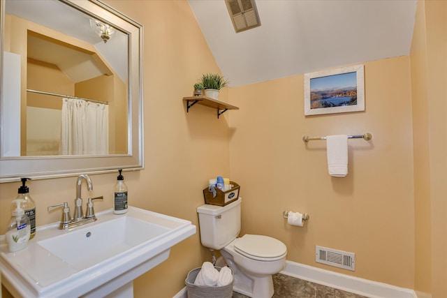 8 Tall Pine Ct, Augusta, GA 30909 - bathroom with a sink, toilet, lofted ceiling, baseboards, and a shower with shower curtain