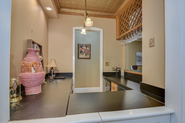 8 Tall Pine Ct, Augusta, GA 30909 - kitchen with ornamental molding, a sink, dark countertops, decorative light fixtures, and wood finished floors