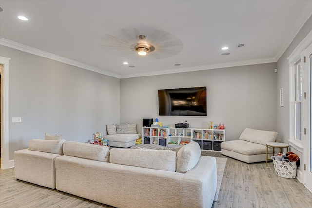 living room featuring ornamental molding, a ceiling fan, recessed lighting, and wood finished floors