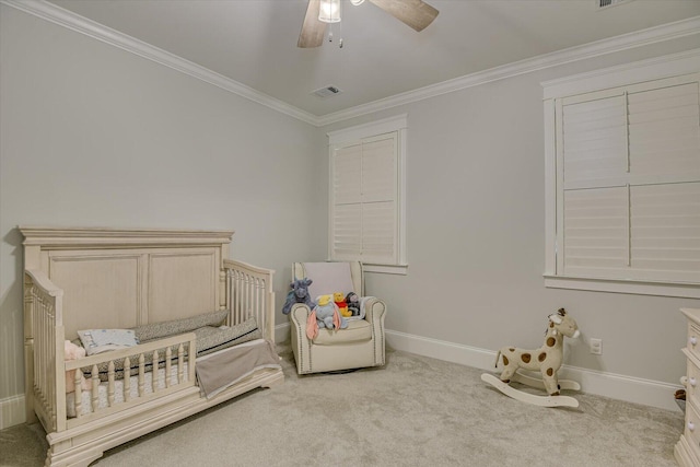 bedroom with baseboards, carpet flooring, visible vents, and crown molding