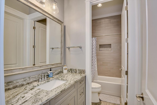 bathroom featuring shower / bath combination with curtain, vanity, and toilet