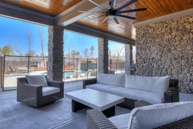 view of patio featuring fence, an outdoor hangout area, and ceiling fan