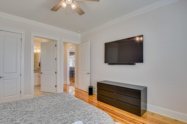 bedroom featuring light wood-style flooring, baseboards, and crown molding