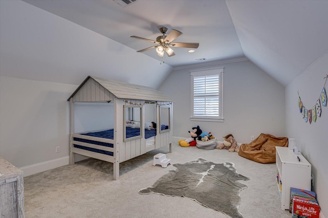 carpeted bedroom featuring lofted ceiling, visible vents, ceiling fan, and baseboards