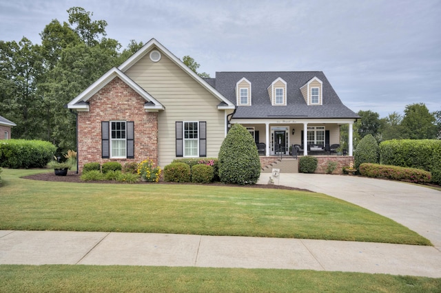 view of front of house featuring a porch and a front lawn