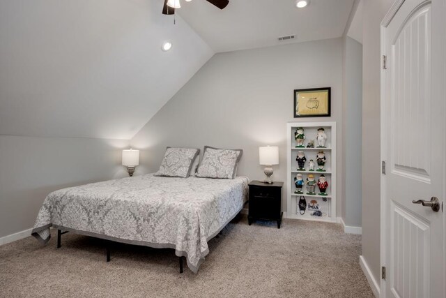 carpeted bedroom with ceiling fan and lofted ceiling