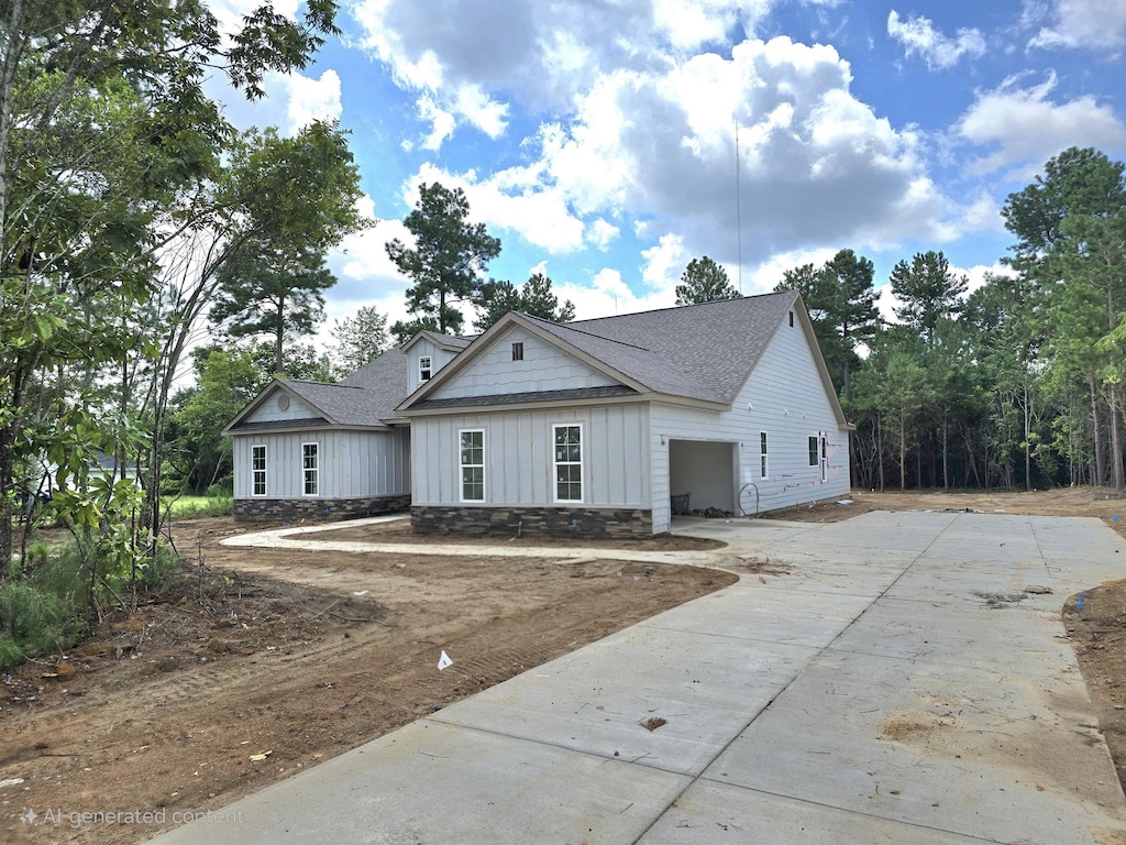 1403 Bellingham Dr, Beech Island, SC 29842 - view of front facade with concrete driveway, a shingled roof, board and batten siding, and a garage