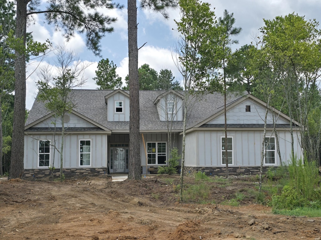 1403 Bellingham Dr, Beech Island, SC 29842 - view of front of property featuring board and batten siding, stone siding, roof with shingles, and french doors