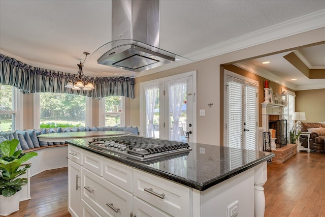 466 Cambridge Way, Martinez, GA 30907 - kitchen with open floor plan, stainless steel gas cooktop, island exhaust hood, ornamental molding, and wood finished floors
