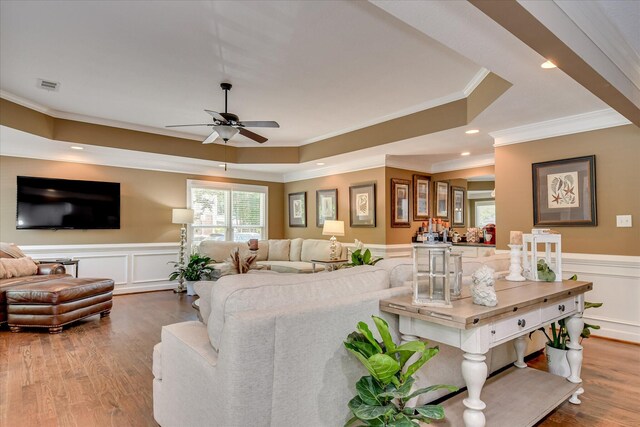 466 Cambridge Way, Martinez, GA 30907 - living room with crown molding, a ceiling fan, a wainscoted wall, wood finished floors, and a raised ceiling