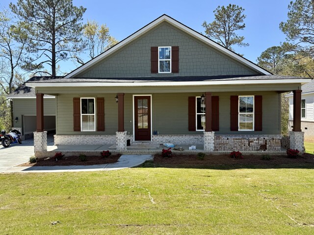 view of front facade featuring a garage and covered porch