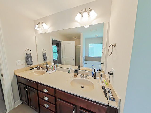 2461 Newbury Ave, Grovetown, GA 30813 - bathroom with double vanity, a garden tub, a stall shower, and healthy amount of natural light