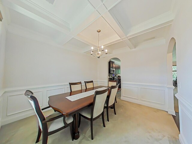 2461 Newbury Ave, Grovetown, GA 30813 - dining room with arched walkways, coffered ceiling, a decorative wall, beamed ceiling, and a chandelier