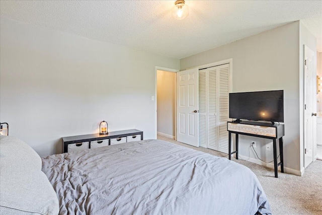 2920 Arrowhead Dr, Augusta, GA 30909 - carpeted bedroom with a textured ceiling, a closet, and baseboards