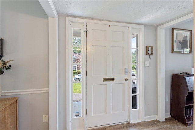 2920 Arrowhead Dr, Augusta, GA 30909 - entrance foyer with a textured ceiling, wood finished floors, and baseboards