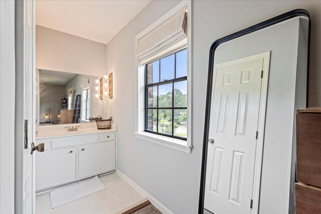 2920 Arrowhead Dr, Augusta, GA 30909 - bathroom with vanity, baseboards, and tile patterned floors